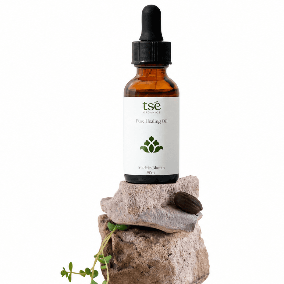 Tsé Pure Healing Oil bottle on a stone pedestal